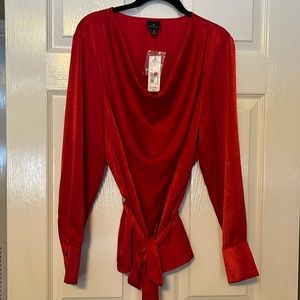 Women’s red draped neckline blouse.